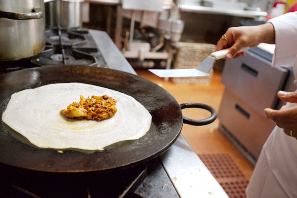 Dosas being made at Junnoon. Photo by Chris Schmauch.