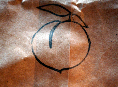 A paper bag with Momofuku's insignia.