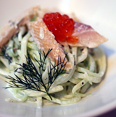Smoked trout atop noodles made of cucumber.