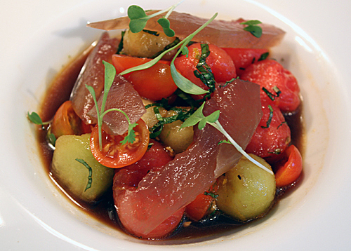 It may look like tuna sashimi, but those are actually slivers of pickled watermelon rind atop that tomato-melon salad.