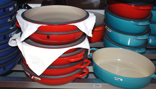 Stacks and stacks of Le Creuset pots at the ready.
