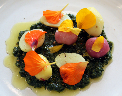 Patterson's new potatoes with salsa verde and edible flowers.