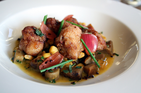 Crispy veal sweatbreads over a bed of wild mushrooms.