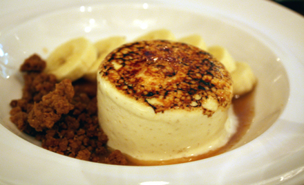 Creamy banana parfait with a bruleed top.