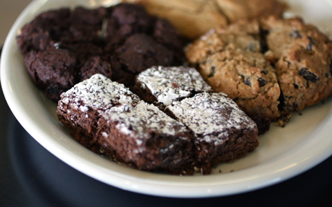 Brownies, double-chocolate cherry cookie, peanut butter cookie, and "Mom's Oatmeal Raisin'' cookie -- cut up in this photo for sharing. Brownies, double-chocolate cherry cookie, peanut butter cookie, and "Mom's Oatmeal Raisin'' cookie -- cut up in this photo for sharing.