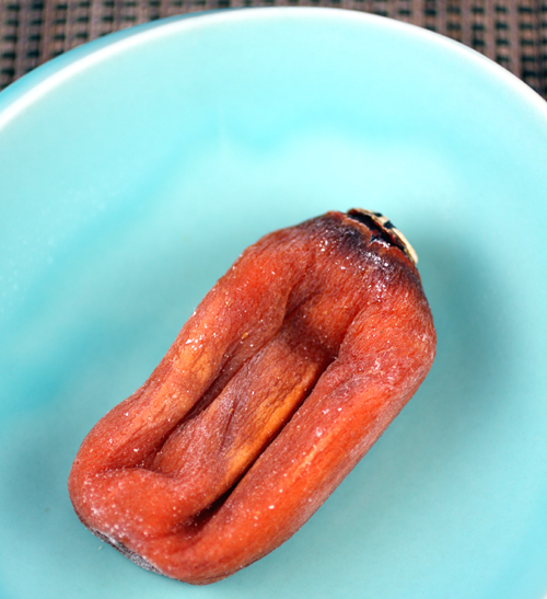 A younger version of the dried persimmon that still has its orange color.