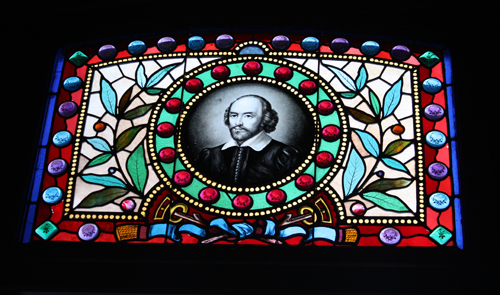 A young William Shakespeare decorates the stained glass window in the library of the Rhine House.
