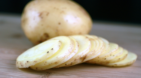 For thicker chips, cut potatoes into 1/8-inch slices like these. For thinner chips, use a mandolin.
