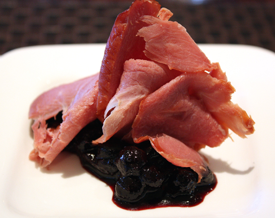 Smoked duck breast with black currants and black olives.