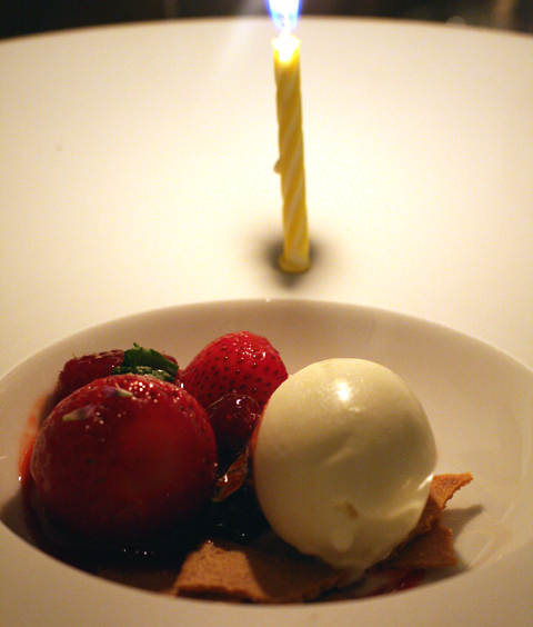 Berries and sorbet -- with a celebratory candle.