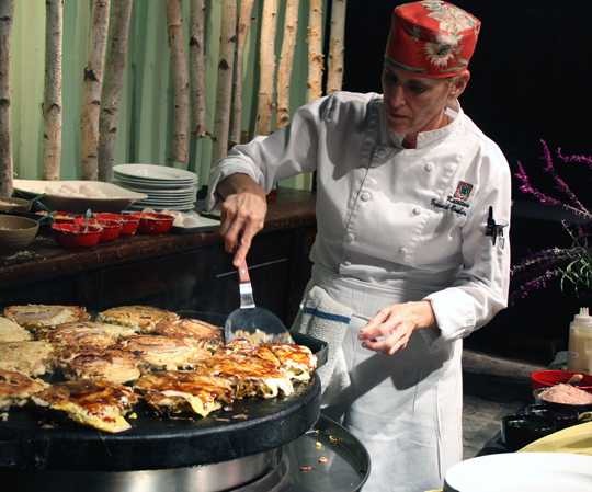 Okonomiyaki -- savory noodle pancakes -- get grilled.