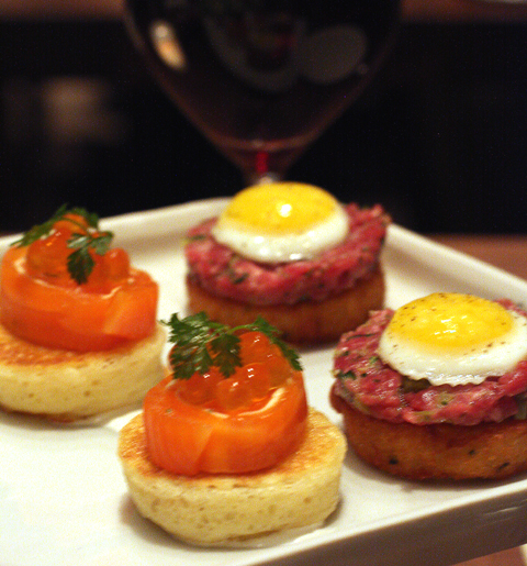 Hors d'oeuvres of cured ocean trout and steak tartare.
