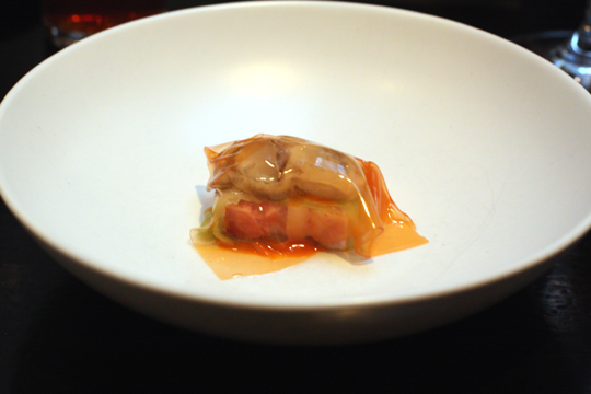 Oyster snuggled with pork belly in a translucent gelatin membrane.