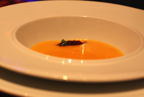 Smooth, silky carrot soup with a garnish of beets.