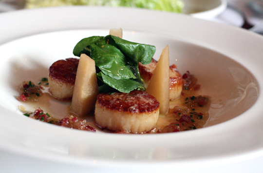Plump scallops get the bacon treatment. (Photo by Carolyn Jung)