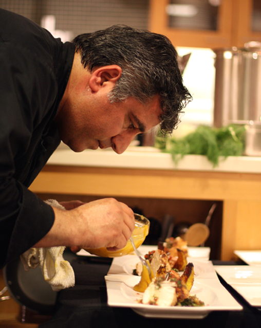 Chef Hoss Zare plating his first dish at the Macy's Union Square cooking challenge.