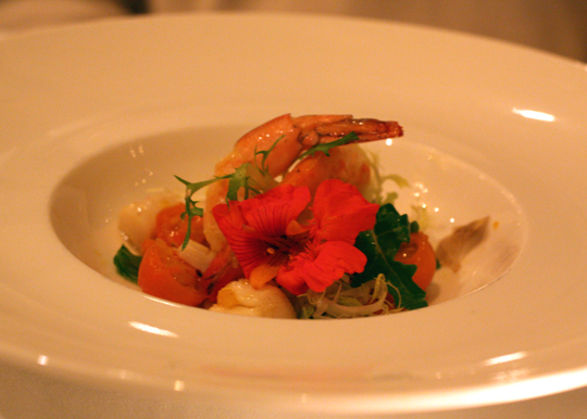 Calamari, shrimp and scallops with heirloom tomatoes and arugula.