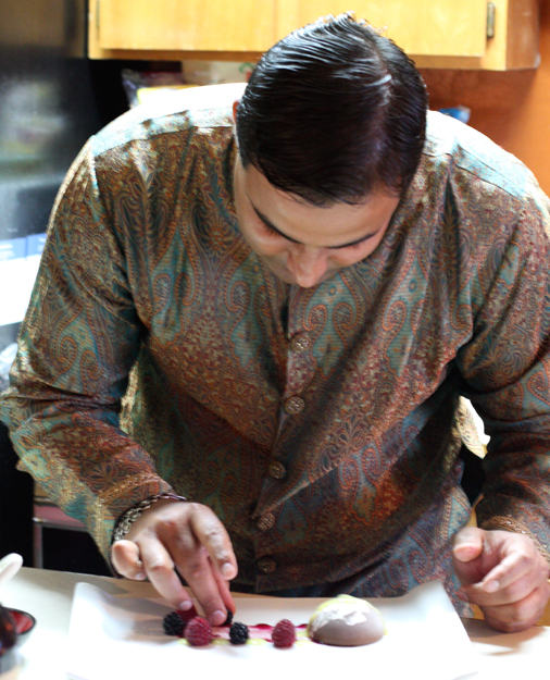 Chef Sachin Chopra, all dressed up for the holiday, puts the finishing touches on a dessert for Diwali.