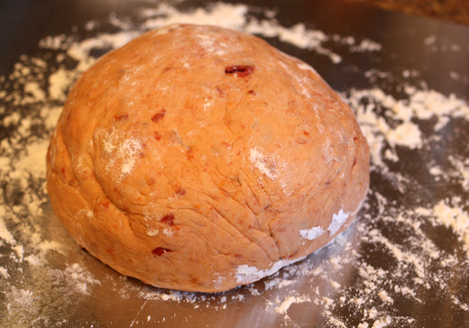 The dough turns almost a salmon color from the chopped sun-dried tomatoes.