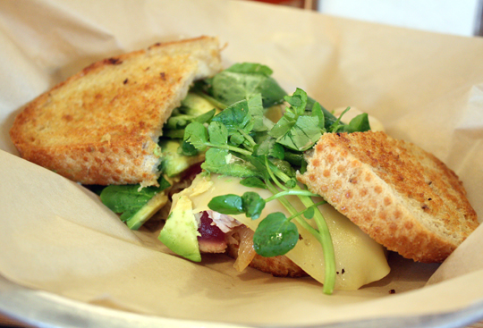 A satisfying ahi sandwich with watercress.