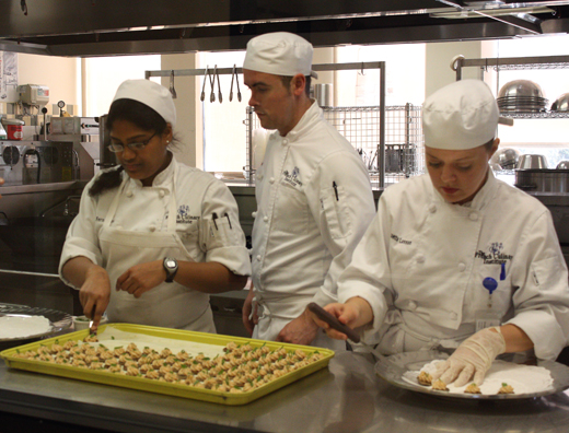 Students preparing food for the reception with Pepin.