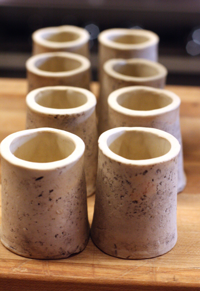 Ceramic "bone marrow'' vessels for a beef cheek dish.