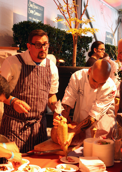 Chris Cosentino, dishing up delectable pork charcuterie iwth help from Chef Mourad Lahlou.