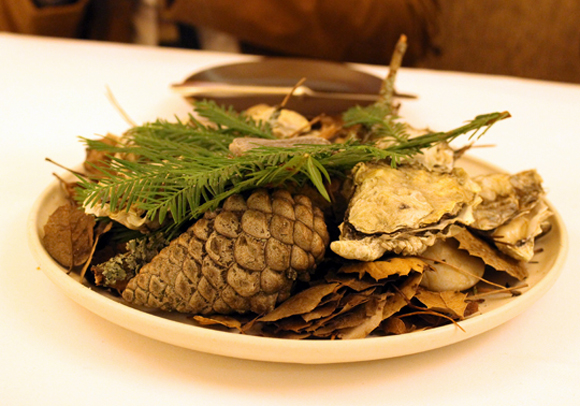 Oysters brought to the table on smoldering redwood branches at Coi in San Francisco, similar to the signature dish of scallops on smoky juniper branches at Faviken in Sweden.