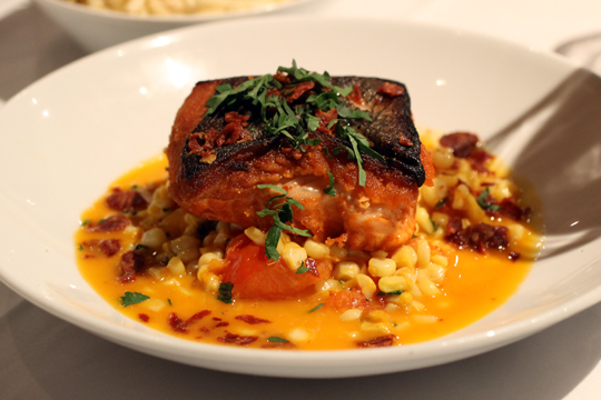 Perfect salmon with a stew of late-summer tomatoes in saffron.