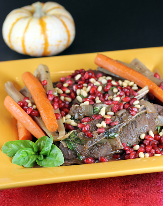 A lamb dish strewn with pretty pomegranate seeds for the holidays.