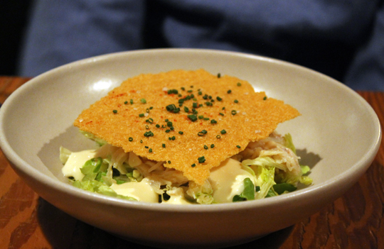 Crab salad with a giant house-made saltine cracker on top.