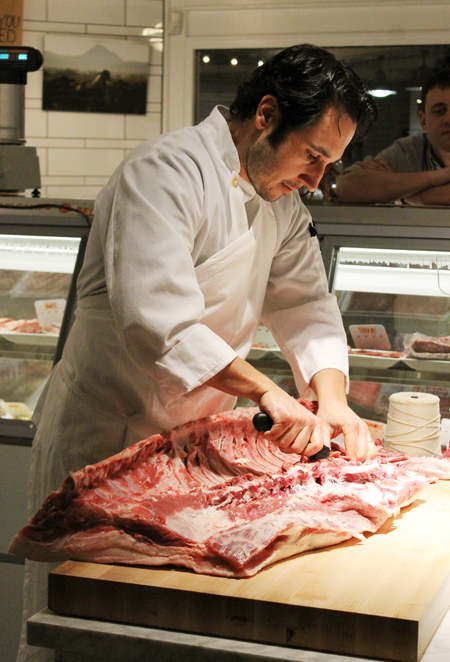 A butcher making porchetta at Belcampo Meat Co. in Larkspur.