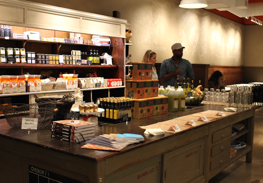 The back part of the store features chocolate, condiments and other gourmet fare for sale.