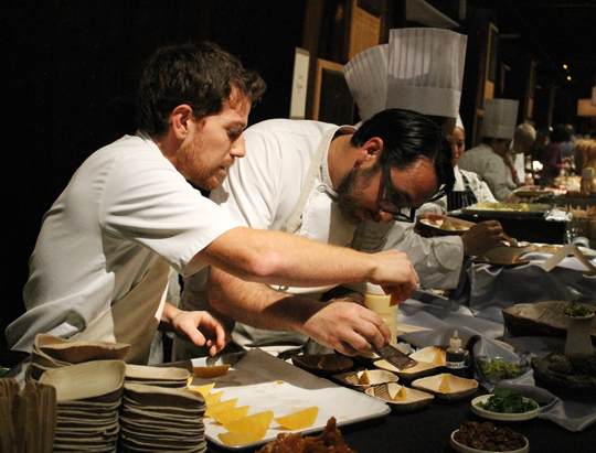 Chef Christopher Kostow of the Restaurant at Meadowood getting a helping hand.