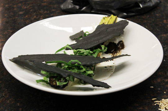 Frederiksen's charred winter leeks with malt powder and ash-like crackers.
