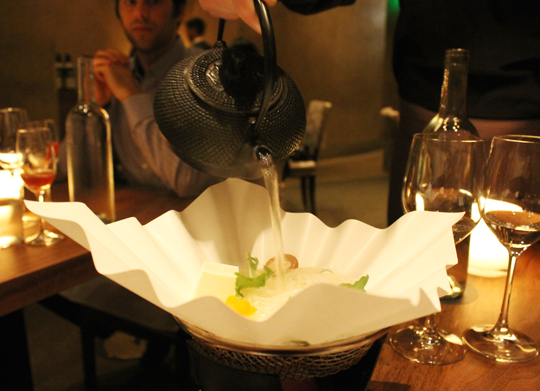 Hot broth poured tableside.
