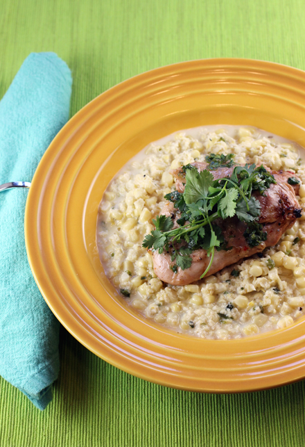 Creamed corn livens up grilled chicken thighs.