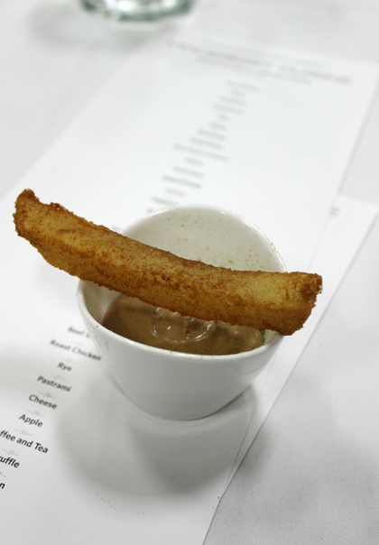 Course #8: Steak Frites. A tiny cup of intense beef mousseline with one perfect French fry balanced on top, its ultracrisp exterior the result of the potato being placed in the same type of ultrasonic bath used to clean jewelry to create bubbles on the tuber’s surface before frying.