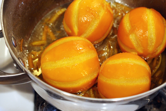 The oranges simmering in sugar syrup.