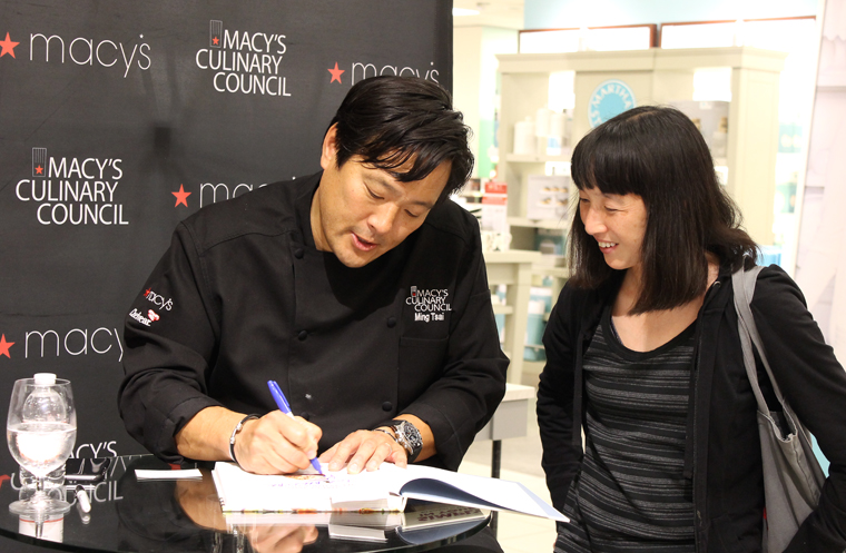 Tsai signing copies of his cookbook at Macy's Valley Fair last week after his demo. (Photo by Carolyn Jung)