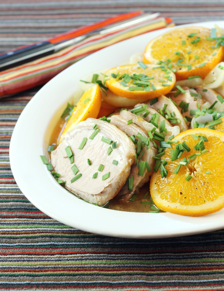 Pork loin gets all pretty and tasty with a profusion of fresh orange slices.