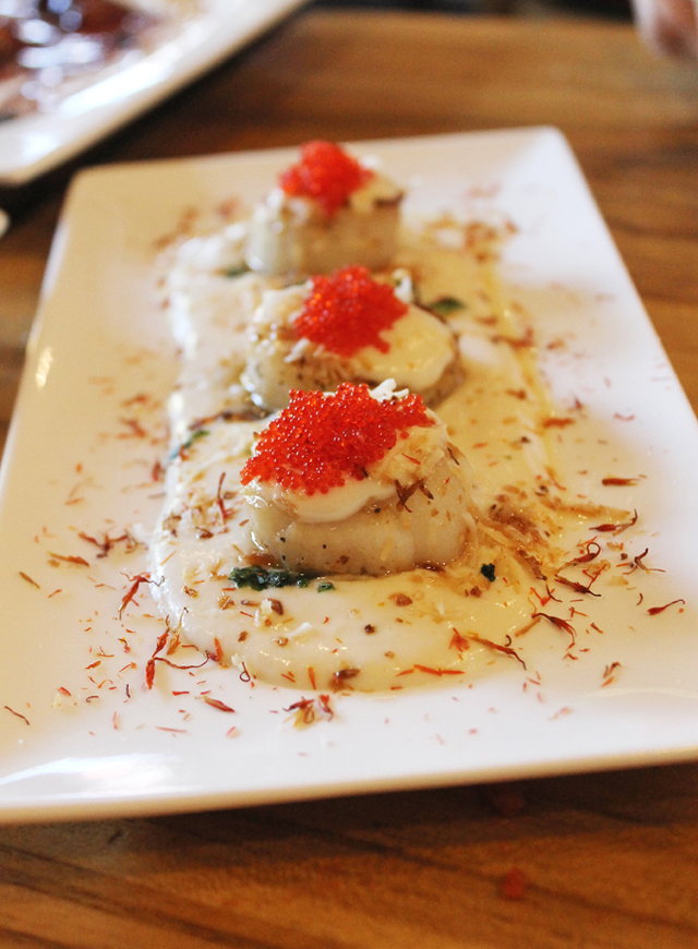 Scallops with a creamy coconut-lychee sauce. (Photo by Carolyn Jung)