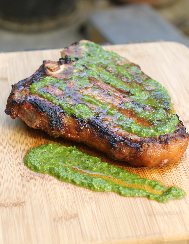 Snake River Farms porterhouse steak gets glam with homemade chimichurri sauce.