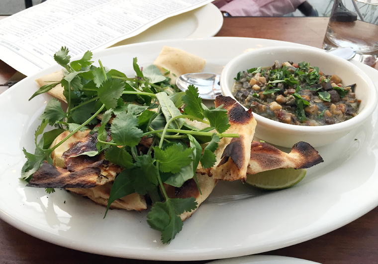 Flatbread with saucy snails.