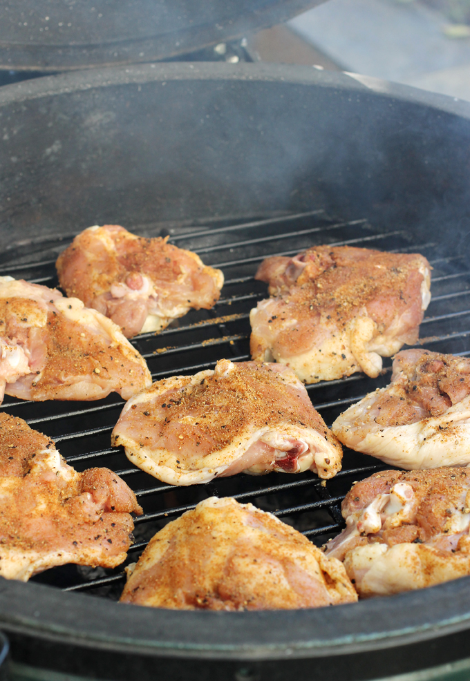 The initial grilling of the chicken -- before they get transferred to a disposable pan atop the grates.