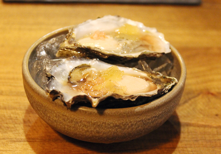 Oysters on the half shell with agro dolce mignotte.