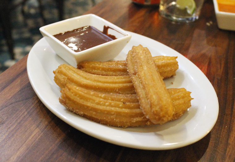 Churros with thick, pudding-like chocolate sauce.