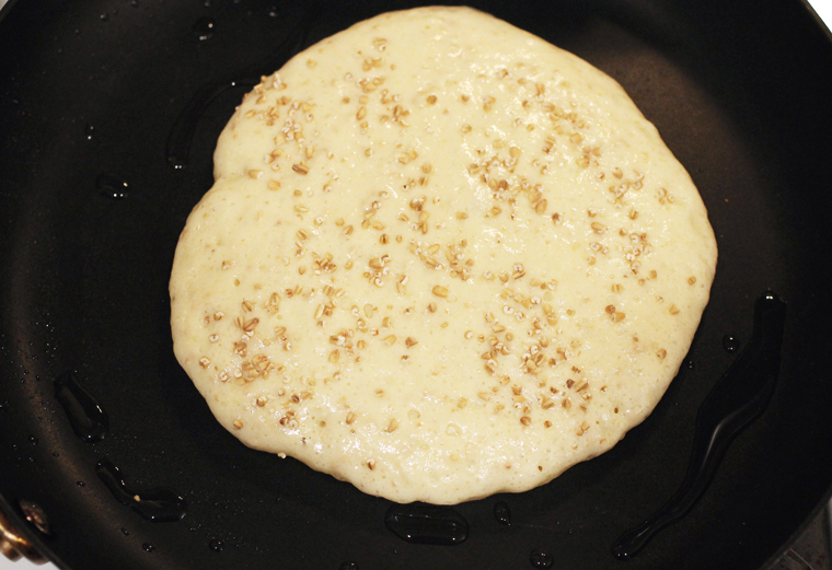 Toasted, ground steel-cut oats get sprinkled on top as each pancake cooks.