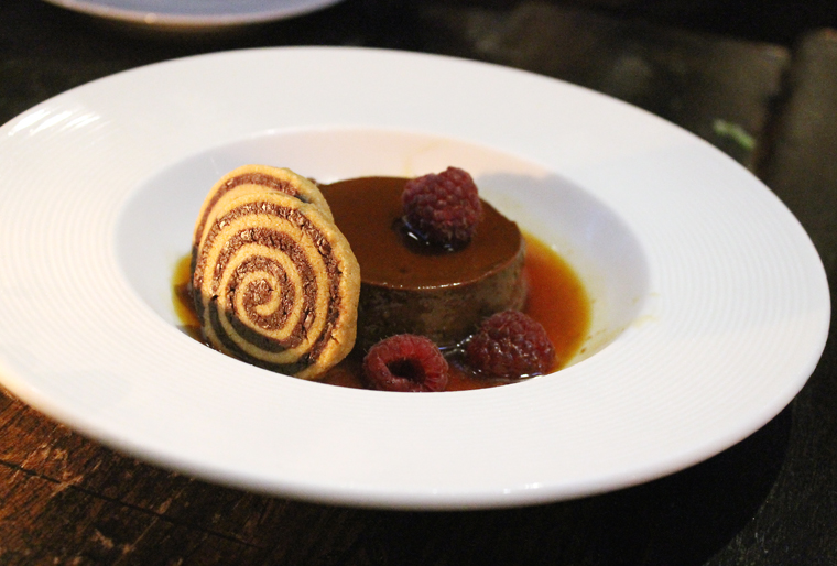 Chocolate flan with spiral cookies.
