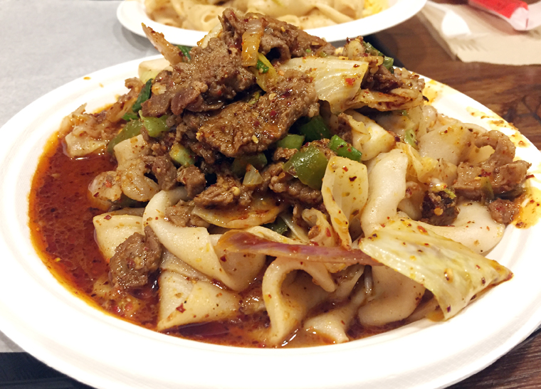 Hand-ripped noodles tossed with spicy cumin lamb.